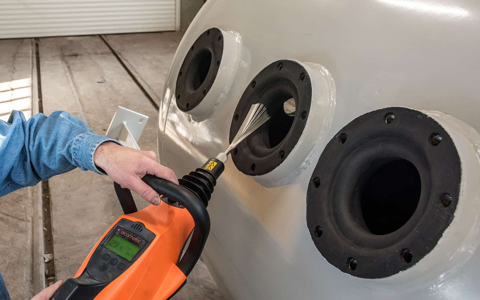 Holiday Inspection of a Rubber Lined Tank Using a Brush Wand Spark Tester